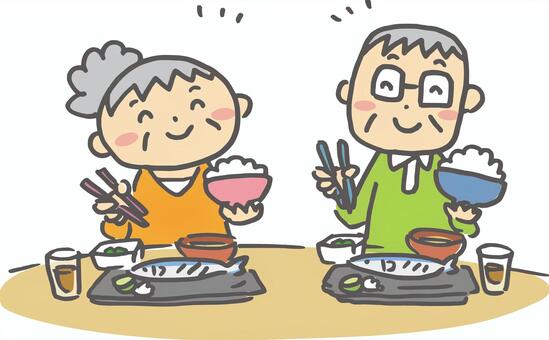 食事をしている高齢男女のイラストです。