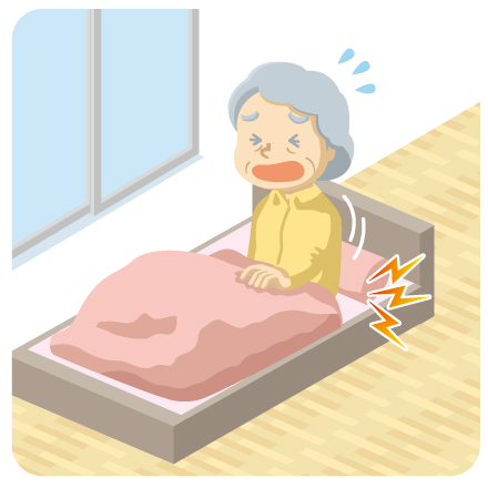 起き上がるとき腰が痛い女性のイラストです。