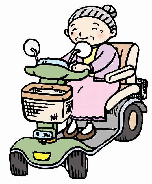 電動カートで移動している高齢女性のイラストです。