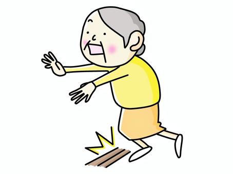 段差につまずいて転倒しそうな高齢女性のイラストです。