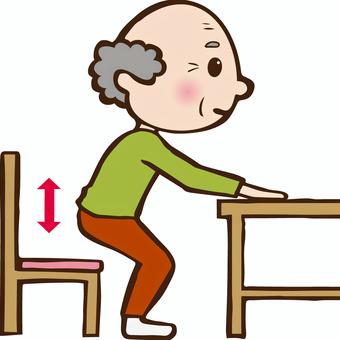 机につかまり、立ち上がりの運動をしている高齢男性のイラストです。