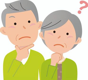 高齢ご夫婦が訪問マッサージについて考えているイラストです。